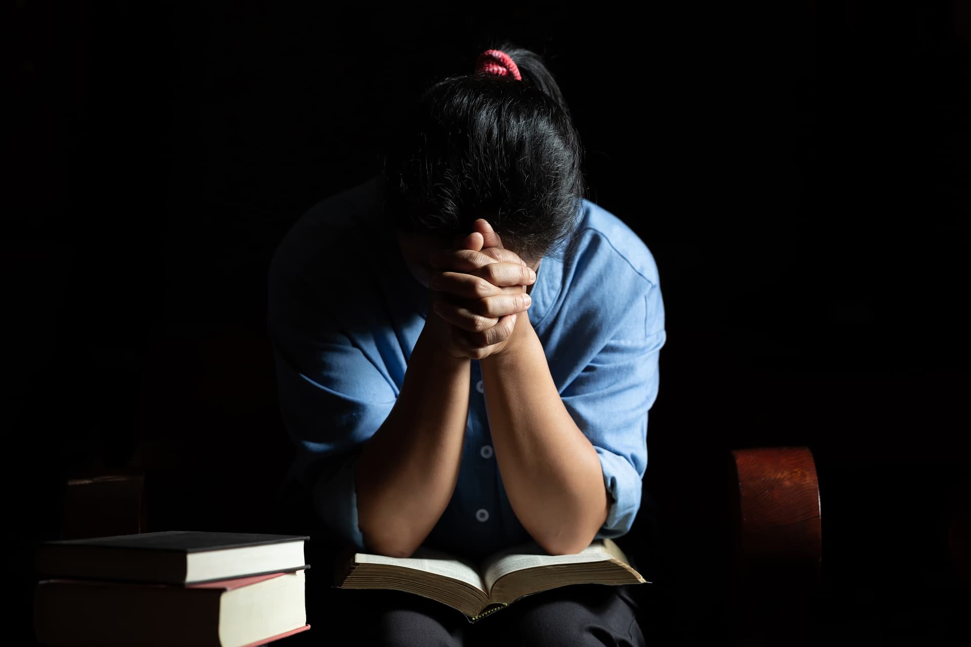 Teenager looking stressed while studying